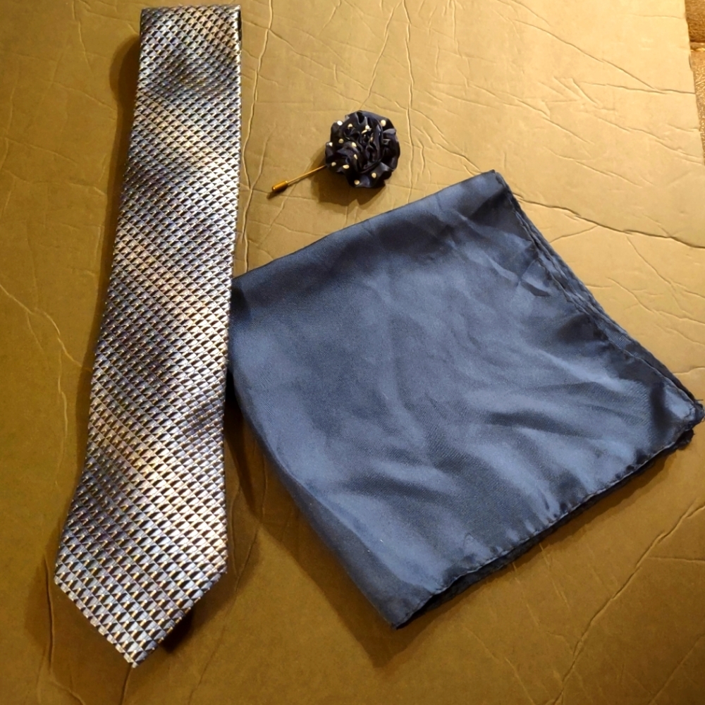 Tie, pocket silk, and lapel pin combo. Excellent condition. Navy blue/grey.